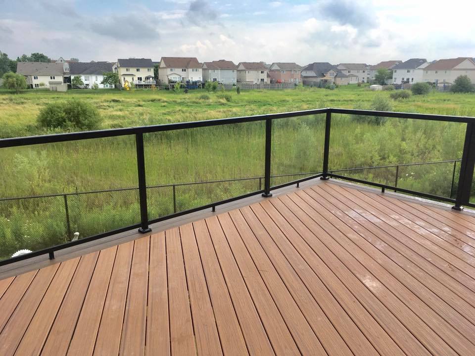 Deck overlooking open green space