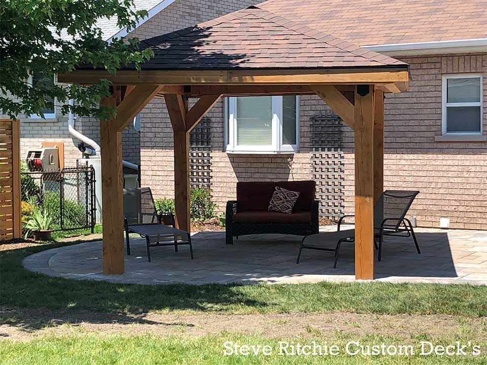 Timber outdoor roof structure with seating below